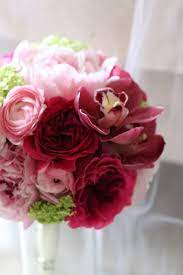 Pink Bouquet With Peony Garden Rose Ranunculus And Cymbidium Orchid To Match The Bride S Traditional Chinese We Hand Bouquet Pink Bouquet Cymbidium Orchids