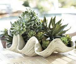 This polystone and capiz long bowl will add a hint of relaxation and peace when displayed on tables and shelves in your coastal style home. Decorating On The Half Shell Clamshells In Home Decor Driven By Decor