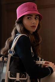 Of Course Another Bucket Hat Emily Loves A Quirky Accessory And This Fluffy Kangol Retro Bermuda B Emily In Paris Fashion Paris Outfits Emily In Paris Outfits