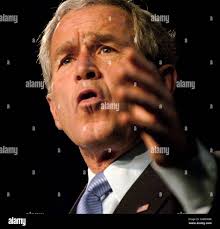 Florida Congressional candidate Vern Buchanan, left, accompanied by  President Bush, waves during a 'Vern Buchanan for Congress' event in  Sarasota, Fla. Tuesday, Oct. 24, 2006. (AP Photo/Gerald Herbert Stock Photo 