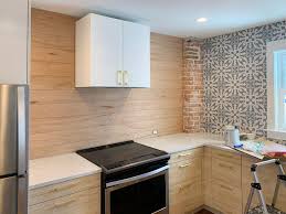 When you use shiplap in the kitchen as a backsplash should you paint it the same color as your kitchen cabinets? Installing A 31 Paneled Wall Treatment Beginners Can Do This Young House Love