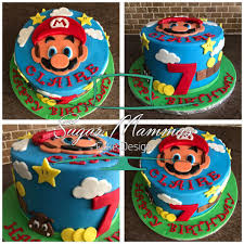 Mario is popping out of the cake hitting one of the blocks, holding a toadstool with many other of his friends, enemies and obstacles from his wildly. Facebook