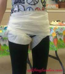 Baby Shower Game Create A New Diaper Style Using Toilet Paper Funny Baby Shower Games Baby Shower Funny Boy Baby Shower Games