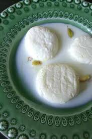 Rasmalai An Indian Dessert Of Cottage Or Ricotta Cheese Dumplings Smothered In Sweet And Creamy Milk Indian Desserts Vegeterian Recipes Indian Pudding