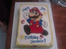 To make the nose, cut the bottom off one of the cupcakes and place it in the center of the round cake. Super Mario Birthday Cake