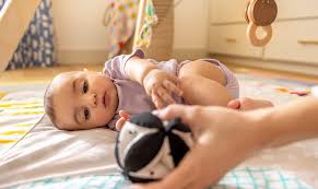 Rolling: When do babies roll over and signs to look for | Lovevery