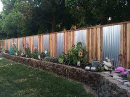 Bamboo fences are beautiful, light weight and let enough light through to prevent too many dark shadows.the rich light green and straw colors of bamboo blend in well in any backyard, but especially if you have tropical plants and accessories. 15 Privacy Fences That Will Turn Your Yard Into A Secluded Oasis Privacy Fence Landscaping Backyard Fences Backyard Privacy