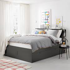 This grey bedroom is actually a completely white room, but the luxurious velvet bed throw the colour theme continues throughout the room, with grey walls complementing bedside furniture. Brimnes Bed Frame W Storage And Headboard Grey Luroy Ikea