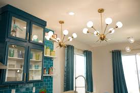 Dining room lighting, living room lighting, bedroom lighting. Modern Blue Kitchen With Gold Light Fixtures Hgtv