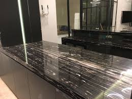 Black marinace granite is a predominately black granite with a combination of black, grey and white pebble stones that was formed at the base of river beds quarried in brazil. Black And White Granites Novocom Top
