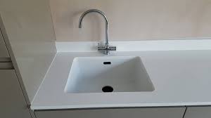 A perfectly functional bathroom vanity with a new vanity top and under mount sink. Santamargherita Vega 20mm Quartz Worktops Waterfall Ends Upstand And White Granite Undermount Sink