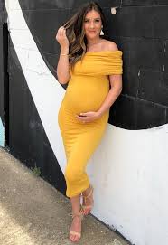 The Golden Yellow Off The Shoulder Fold Over Ruched Dress Is Where Comfort Meets Class Maternit Yellow Maternity Dress Maternity Dresses Baby Shower Dresses