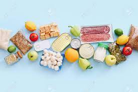 Set Of Grocery Items From Canned Food, Vegetables, Cereal On Blue Bacground. Food Delivery Concept. Donation Concept. Top View. Stock Photo, Picture And Royalty Free Image. Image 153224242.