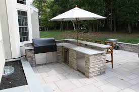 A large kitchen and outdoor entertaining space from cc designs in denver, colorado features general shale sequoyah stone, mediterranean private bar and kitchen. Custom Built Outdoor Kitchens Grills Burkholder Landscape