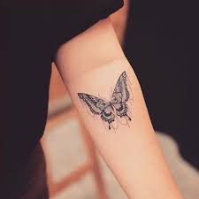 Small tribal tattoo on wrist. Butterfly Tattoos The Best Of 2021