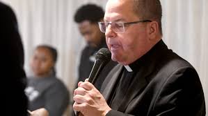 Bishop David Bonnar blesses Habitat home built by Catholic volunteers