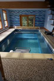 A Beautiful Mosaic Tile Wall Complements The Blue Of This Endless Pool Endless Pool Garden Pool Indoor Pool