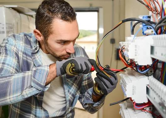 Electrician testing a newly installed USB charging socket