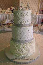 3 Tier All White Wedding Cake Decorated With Buttercream Rosettes Quilting And Scrolling And Acc Wedding Cake Decorations Scroll Wedding Cake Wedding Cake Pops