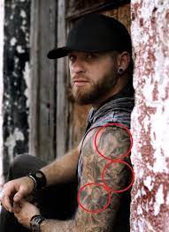 His ink, including an intricate left sleeve, represents the faith and values of a 2nd amendment supporter who faced some setbacks before starting a family. Brantley Gilbert S 16 Tattoos Their Meanings Body Art Guru