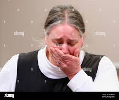 Tamara Gribble, mother of Christopher Gribble, leaves the witness stand  prior to a lunch recess in Hillsborough County Superior Court in Nashua,  N.H., Monday, March 14, 2011. Christopher Gribble is