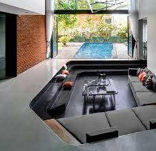 Over the last few weeks we've been working hard to get our sunken den raised up to the level of the kitchen. Design Detail A Sunken Living Room Sits By The Pool At This New House