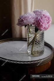 Maybe you would like to learn more about one of these? Fresh Cut Pink Peonies In Jar On Small Table Floral Arrangement Decor Stock Photo 178861256