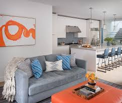 If you wish to enhance the look of the home with a coffee comfortable theme, you will need a coffee table. Blue Tufted Sofa With Orange Ottoman Coffee Table Contemporary Living Room