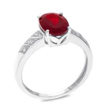Oval Garnet And Diamond Accent Ring In Sterling Silver