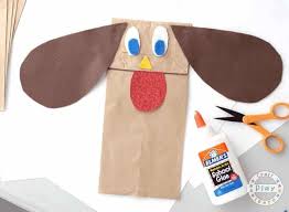 Draw on eyes, spots, a collar, or any other decorations, be creative! Paper Bag Dog Puppet Craft For Kids The Inspiration Edit