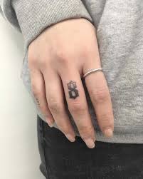 Another cute idea would be to add a disney character to your date tattoo design especially if it is dedicated to your son or daughter. Pin On Finger Tattoos