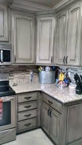 Grey kitchen cabinets with white marble countertops. Valspar Aspen Gray With Black Glaze New Kitchen Cabinets Kitchen Remodel Glazed Kitchen Cabinets