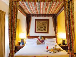 Stylish ghanaian + background art by: African Regent Hotel Business Destinations Make Travel Your Business