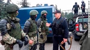 Lukashenko's weapon can be seen resting by his side during the flight. Alexander Lukashenko Flies Over Belarus Protests In Helicopter Brandishing A Rifle Cnn
