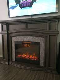 Open compartment above insert for media equipment. 62 Grand Gray Electric Fireplace Big Lots