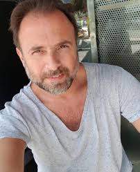 This is my husband, Joe. Joe said NO DOGS! Especially not a yappy little  chihuahua. Now Joe and Louie are the best of friends 💙🐶💙