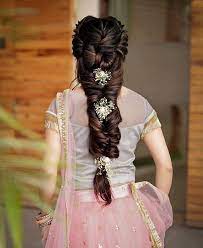 When In Doubt Braid Your Hair And Add Flowers These Bridal Hairstyles Are Perfect For A Summer Bridal Hair Buns Indian Hairstyles Traditional Hairstyle