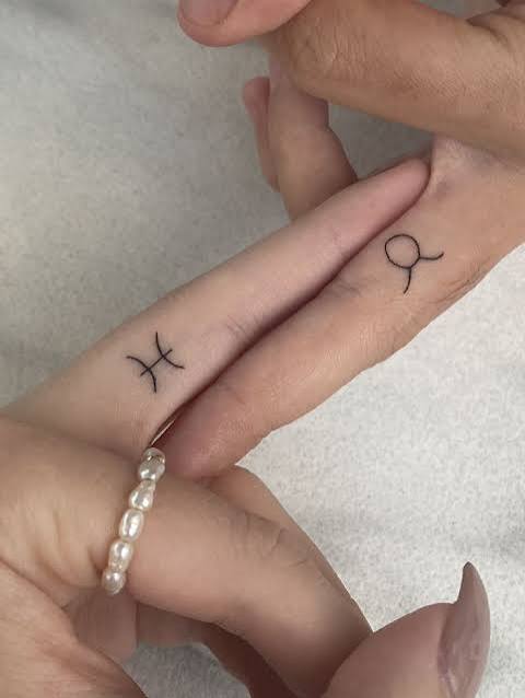 Fine line star sign tattoo