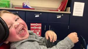 Michael has been trialing 3 different communication devices at school. His  teacher sent me a video of him working