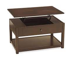 The lift on the coffee table can open up an area for storage inside of the table for books, magazines, remotes, or other small items you have hanging around your living room. Marion Lift Top Coffee Table Hom Furniture