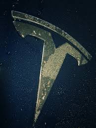 The default wallpapers change with each ios update. Tesla Logo Wallpaper Posted By Sarah Johnson
