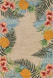Front porch with indonesian 1960's rattan furnitures, prewashed batik patchwork throw pillows, and kawung (flower of life) patterned handmade cast concrete elevated north terrace with vibrant colors overlooking estate shoys and caribbean sea. Tropical Runners At Rug Studio