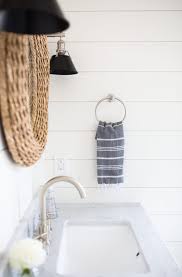 The sturdy bathroom floating shelves provide storage in a rustic, yet cozy, farmhouse style. Backyard Pool House Interior Design Tour To Have To Host