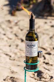 10 Diy Outdoor Lights For Your Patio Genius Outdoor Ideas Lighting Ideas By Design Fixati Wine Bottle Tiki Torch Diy Wine Bottle Tiki Torch Wine Bottle Diy