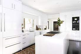Simple white cabinets and clean silver hardware work well alongside wooden countertops and light colored wall paint. 14 Best White Kitchen Cabinets Design Ideas For White Cabinets
