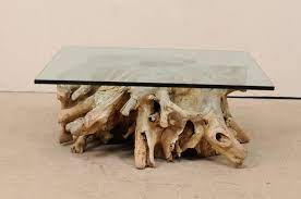 The decorative steel along the sides make the bottom of the side table look both open and closed at the same time. Custom Glass Top Coffee Table On 19th C European Natural Wood Tree Stump Base For Sale At 1stdibs