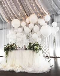 22 Creative Fun Ways To Use Balloons In Your Wedding Wedding Balloon Decorations Wedding Balloons Bride Groom Table