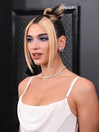 She walked the red carpet in a sparkly versace gown with a butterfly bodice. Dua Lipa S 90s Inspired Hairstyle At The 2020 Grammys Popsugar Beauty