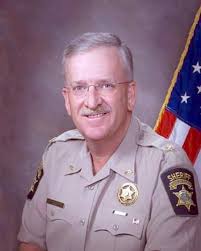 In God We Trust' decals added by sheriff to vehicles