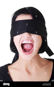 Portrait of young blindfold woman screaming Stock Photo - Alamy